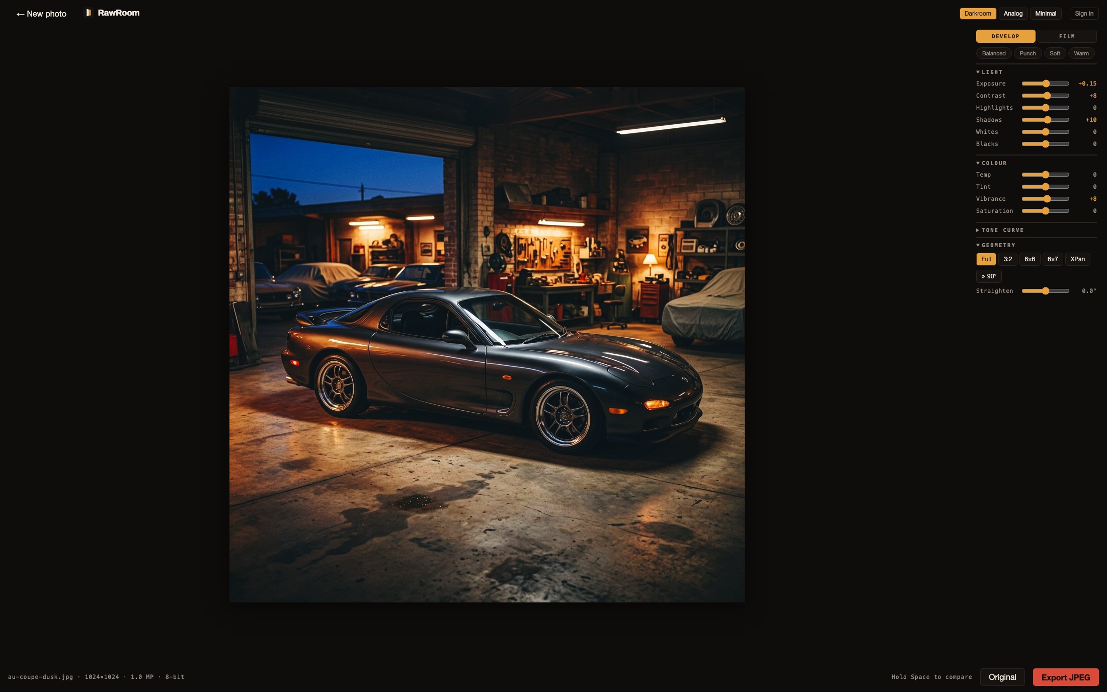 The RawRoom editor: a photo of a sports car in a garage at dusk open in the workspace with CineStill 800T applied, the develop panel on the right showing Develop and Film tabs, quick-preset chips and Light, Colour, Tone curve and Geometry sliders with adjusted values in amber, and the file info, compare and export controls along the bottom.